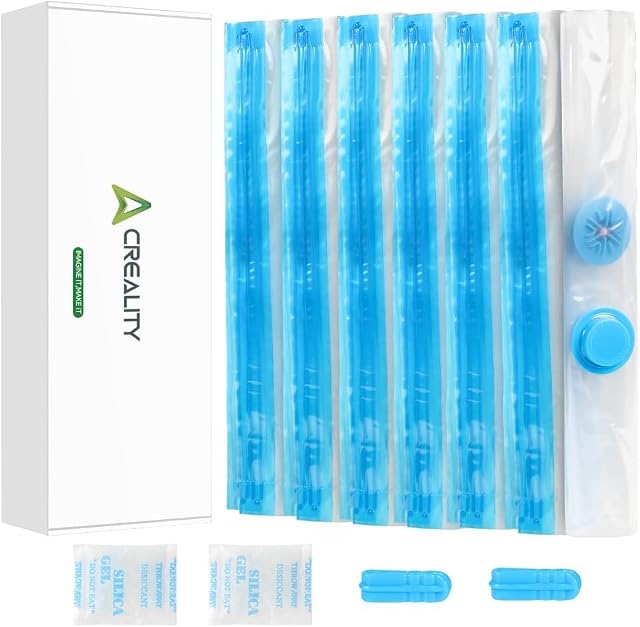 Scatola Creality accanto a sacchetti piegati con zip blu, una valvola rotonda con tappo, due bustine di gel di silice e due cursori zip blu