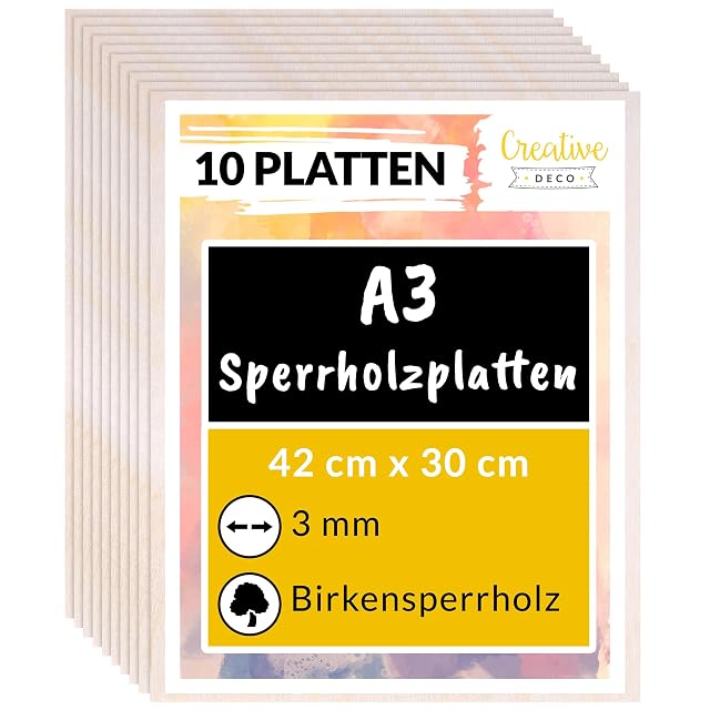Pila di pannelli di compensato sotto un’etichetta Creative Deco con la scritta 10 Platten, A3, 42 × 30 cm, 3 mm, Birkensperrholz