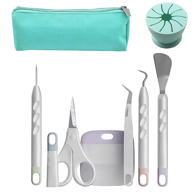 Borsa con cerniera verde petrolio, un raccoglitore di scarti rotondo in silicone verde petrolio, punteruolo, forbici con cappuccio, raschietto, pinzetta, uncino e spatola